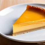 Home 14 크리미한 제과 제품 - **Prompt:** A close-up, high-angle shot of a classic Spanish 'Flan de Huevo' (egg flan) on a pristin...